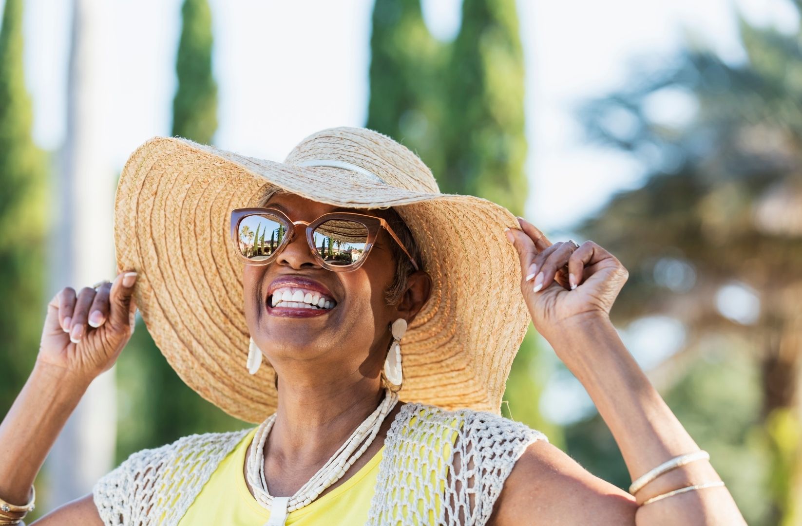 Wearing a hat with sunglasses
